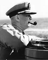 Photo # 80-G-1019527:  Admiral Arleigh A. Burke on the bridge of a ship at sea, circa 1955-1957