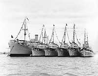Photo # 80-G-1025121: USS Black Hawk with four destroyers and USS Heron alongside, at Manila, 15 November 1935