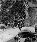 Italian prisoners, taken at Dessie, struggle across one of their own demolitions.
