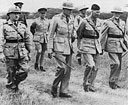 Brigadier F. L. A. Buchanan, Lieut.-General Sir Pierre van Ryneveld, Lieut.-General Alan Cunningham, and General Smuts on a visit to troops of 2nd S.A. Infantry Brigade Group.