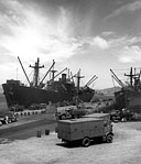 SHIPS LOADING at the harbor, Noumea, New Caledonia, 12 February 1943