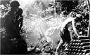 firing a 4.2-inch M2 chemical mortar into an enemy position