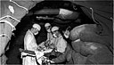 Emergency operation being performed in a dugout