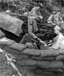 INFANTRYMEN FIRING MORTAR