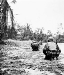 ADVANCE PATROL CREEPING ALONG A BEACH