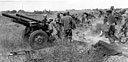 105-mm. howitzers M2A1 firing at the city of Bamban, 26 January 1945