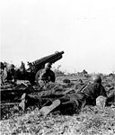 CREW OF A 75-MM. PACK HOWITZER M1A1 being subjected to small arms fire on Corregidor