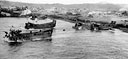 SUPPLIES, EQUIPMENT, AND TROOPS coming ashore at Legaspi