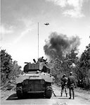 TROOPS ADVANCING ON A ROAD EAST OF MANILA