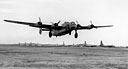 B-24 TAKING OFF FROM THE AIRSTRIP AT YONTANZAN for a mission over Japan