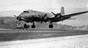 Douglas C-54 Skymaster arriving at Yontanzan airstrip on a flight from Guam