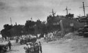 COAST GUARD MANNED LST's UNLOAD AT MANILA