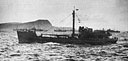 A BUSY 'ISLAND HOPPER' MANNED BY COAST GUARDSMEN FOR THE ARMY IN THE PACIFIC WAR