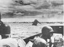 COAST GUARDSMEN UNDER FIRE, LANDING AT TARAWA, BRINGING SUPPLIES TO BEACHHEAD