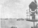 LOADED TROOP TRANSPORTS LIE IN HARBOR AT MANUS