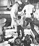 SURVIVORS OF THE Coast Guard Cutter Jackson WHICH CAPSIZED IN A HURRICANE OFF THE VIRGINIA COAST ARE TRANSFERRED FROM THE WING OF A COAST GUARD RESCUE PLANE INTO THE AFTER COCKPIT OF A COAST GUARD VESSEL WHICH RUSHED THEM ASHORE FOR HOSPITALIZATION