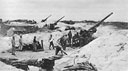 155mm guns of the 420th Field Artillery Group are set up on Keise Shima to shell 
enemy main defenses prior to the Tenth Army assault landing.