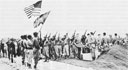 Men of the Tenth Army pay homage to their fallen leader, Lieutenant General Simon B. Buckner, Jr.