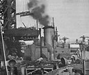 Unloading a Squadron 13 boat from a merchant ship at Seattle