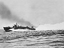 Two PT's slide past an LST in Salerno harbor during the invasion of Italy
