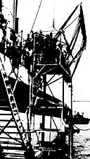 Figure 109.--The U.S.S. Samaritan anchored off Okinawa.
Transferring a patient from a small boat via an
elevator rigged over the side of the ship.