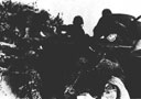 Figure 118.--Transferring the wounded men from amphibious tractor to a landing barge.