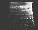 Figure 133.--(Foreground) Casualties being carried aboard an LST on an invasion beach in France.
