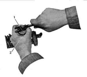 Removing buffer adjusting screw.