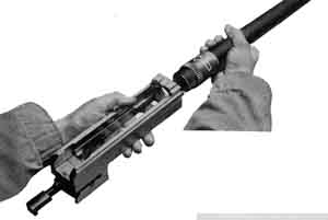 Screwing barrel into barrel extension.