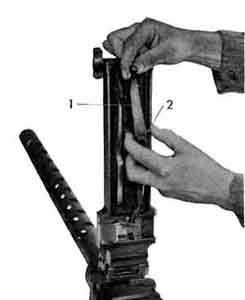Remopving the belt feed lever.